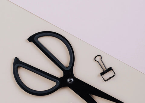 Top view of black office supplies on a desk