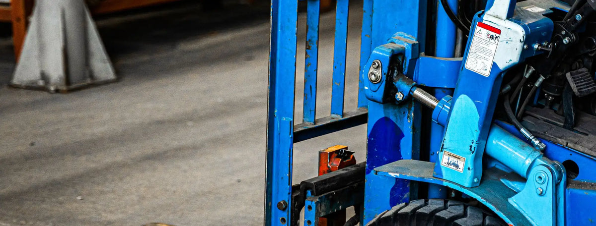 Forklift moving pallets inside a supply warehouse